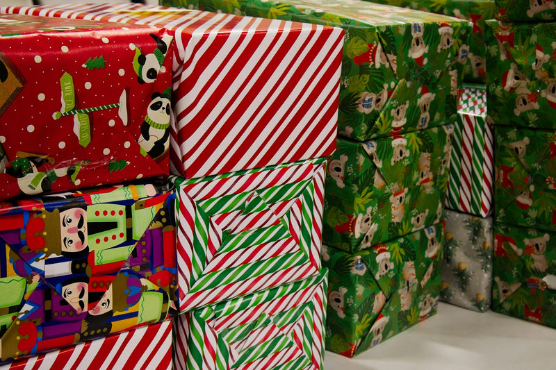 Wrapped holiday gift boxes in festive paper